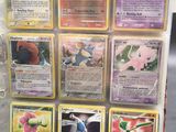 a lot of pokemon cards on display in a case