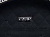 chanel, a black and white quilted shoulder bag