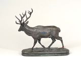 statue of a deer with antlers on a white background