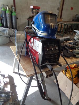 a blue helmet on top of a table in a garage