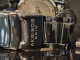 a watch that is sitting on a glass table