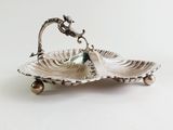 an image of a silver plate with a seahorse on it