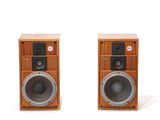 pair of speakers on a white surface with a white background