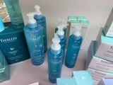 many different types of skin care products displayed on a table