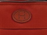 a close up of a red bag with a zipper on it