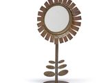 an image of a mirror on a stand with a flower in the middle