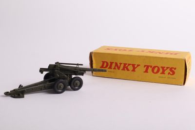 dinky toy gun with box and box on white background