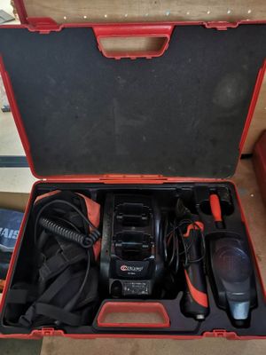 an open tool case with tools in it sitting on a table