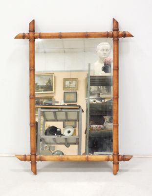 a mirror that is sitting on a shelf in a room