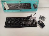 a keyboard and mouse sitting on a table next to a box