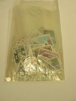 a bag full of stamps sitting on a table