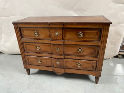 an old wooden dresser with four drawers and brass pulls