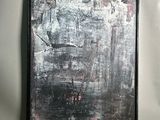 painting on the wall of a gray room with a black frame