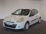 a picture of a small white car parked in a garage