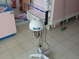 a hair dryer that is on a stand in a room