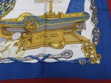 a blue and white scarf with a picture of a boat