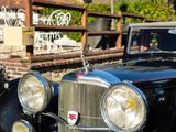 an image of a classic car parked on the side of the road
