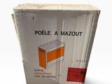emballage d'une boîte sur laquelle figure l'image d'un poêle