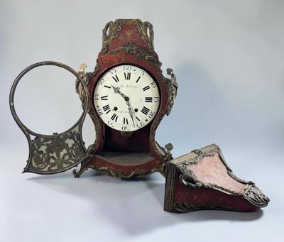 a clock that is sitting on a table next to a mirror