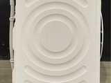 an image of a white washing machine in a room