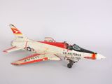 a toy airplane that is sitting on a white surface
