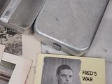 a small tin with a picture of a man on it