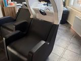 an image of a salon chair with a hair dryer on it