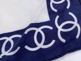 a blue and white scarf with a chanel logo on it
