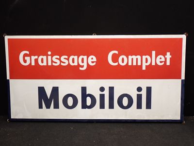un panneau rouge et blanc sur lequel on peut lire « grassage complete mobioli »