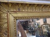 a mirror that is hanging on the wall in the room