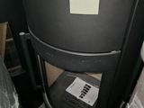 a black trash can sitting next to a black trash can