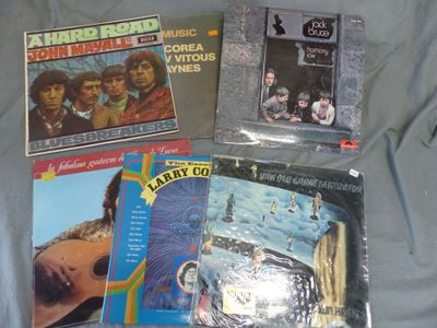 a lot of records on a bed with a sheet of paper