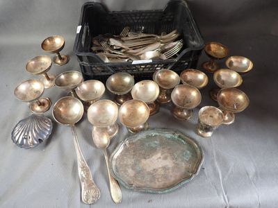 a lot of silver spoons and spoons on a table