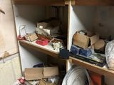 a room with a bunch of boxes on the shelves