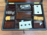 a wooden box with a set of playing cards inside of it