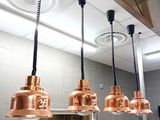 three lights hanging from the ceiling in a kitchen