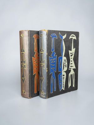 two books that are sitting side by side on a table