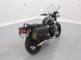a motorcycle that is parked in a white room