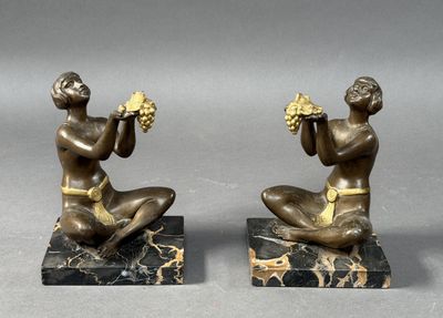 pair of antique bronze figurines of a man and a woman on marble bases