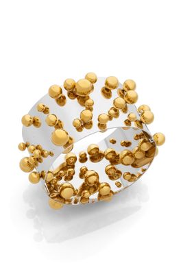 a close up of a ring with gold balls on it