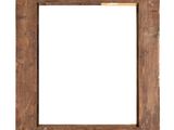 an old wooden picture frame hanging on a white wall