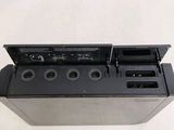 a black electronic device that is sitting on a table
