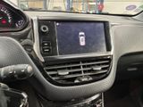 the dashboard of a car with a cell phone in the center of it