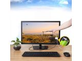 a person touching a computer screen on a desk