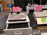 many electronic devices on the counter in the kitchen