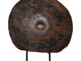 a large piece of metal on a stand on a white background