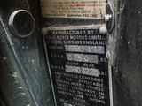 a close up of a metal door with a sign on it