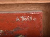 a close up of a painting on a shelf in a room