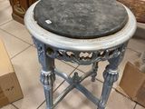 a small table that has a black top on it