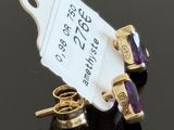 pair of gold and amethorate earrings and a pair of gold and amethorate earrings